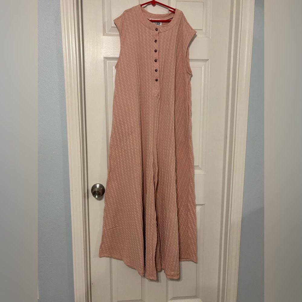 New with tags peach/pink romper jumpsuit size small